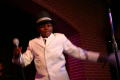 Photograph: [Boy in suit dancing on stage]