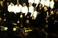 Photograph: [Choir and band on stage]