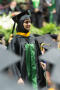 Thumbnail image of item number 1 in: '[Graduate Student Walking with her Diploma]'.