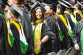 Primary view of [Masters Recipient Smiling for Photo at Commencement Ceremony]