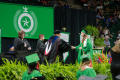 Photograph: [Bachelor's Graduate shaking hands on stage]