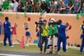Photograph: [Photographers on sidelines of UNT Homecoming game]