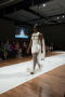 Primary view of [Fashion model walking down runway]