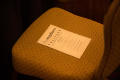 Photograph: [Literary Lights Dinner schedule of events on chair]