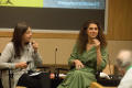 Photograph: [Dianne Solis and Alia Malek speaking during panel]