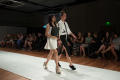 Photograph: [Design student walking on runway with model]