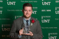 Primary view of [Austin Allen holding his award]