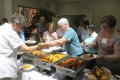 Primary view of [Attendees getting food from buffet 2]