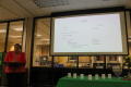 Photograph: [CSLA administrator Judy Janzen giving report at meeting]