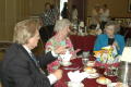 Primary view of [Three attendees at banquet table]