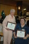 Photograph: [Elaine Amromin and Lois Ward holding their awards]