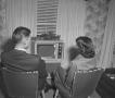 Photograph: [Man and woman watching television, 2]