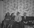 Photograph: [Two men and two women on a couch, 2]