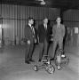 Photograph: [three men in a warehouse]