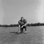 Photograph: [Football player kneeling with the ball, 41]