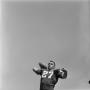 Photograph: [Football player throwing a football, 5]