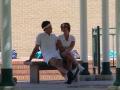 Photograph: [Actors sitting together on bench]