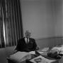 Photograph: [Photograph of Dr. Gafford at his desk #1]