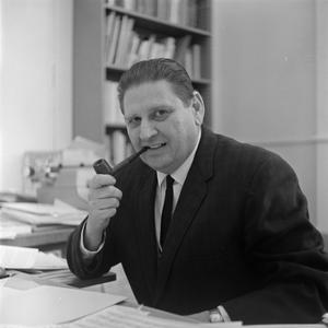 Primary view of object titled '[Photograph of Dr. Friedsam at his desk #1]'.