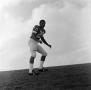 Photograph: [Football player standing on a hill]
