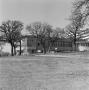 Photograph: [Clubhouse with makeshift fence]