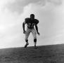 Photograph: [Football player standing on a hill, 3]