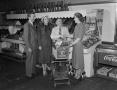 Photograph: [Frank Mills, Florence Helen and others at a grocery store, 2]