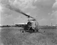 Photograph: [Helicopter in a field]