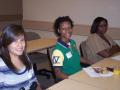 Primary view of [Ariana Guardado and Erica Patton sitting at tables]