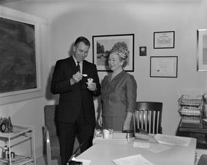 Primary view of object titled '[Bob Walsh with an unknown woman]'.