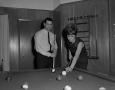 Primary view of [Bill Enis playing pool with his wife]