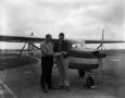 Photograph: [Alex Burton and an unknown man at the airport]