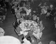 Photograph: [Photo of dining audience at station party]