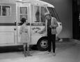 Primary view of [Bobbie Wygant with guest showing an RV]