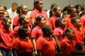 Primary view of [Children sing on stage to audience]