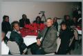 Photograph: [Guests attending Christmas Kwanzaa soiree]