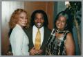 Primary view of [Photograph Curtis King posing with two women]