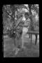 Photograph: [Carol and Tim Williams sitting on a tree branch]