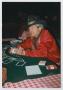 Primary view of [Photograph of a man at a poker table]