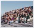 Photograph: [Photograph of interactive TAMS students on UNT stadium bleachers]
