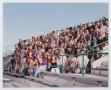 Photograph: [Photograph of TAMS students interacting on UNT stadium bleachers]