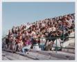 Photograph: [Photograph of TAMS students moving on the UNT stadium bleachers]