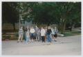 Photograph: [Photograph of TAMS group posing on sidewalk]