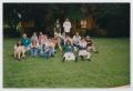 Photograph: [Photograph of TAMS students sitting on lawn]