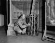 Photograph: [Ed Milner painting the set]