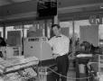 Photograph: [Cashier at a grocery store]