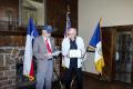 Photograph: [Allan Husch presenting certificate in chapter meeting, November 10, …