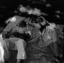 Photograph: [Photograph of a man and a woman lounging on a picnic blanket]
