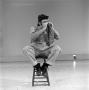Photograph: [Bill Kelley sitting on a stool]