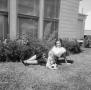 Photograph: [Photograph of Doris reclining outside with baby Albert]